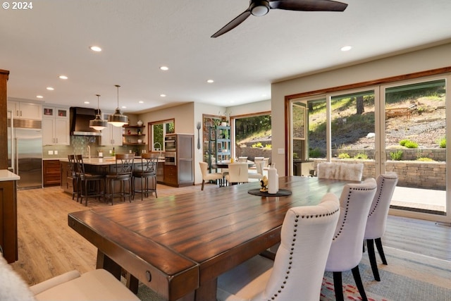 dining space featuring a ceiling fan, recessed lighting, and light wood-style floors