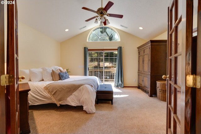 bedroom featuring vaulted ceiling, light colored carpet, visible vents, and ceiling fan