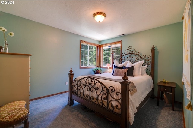 carpeted bedroom featuring baseboards and visible vents