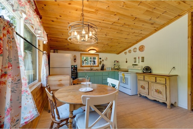 dining room featuring lofted ceiling, wood ceiling, crown molding, and light wood finished floors