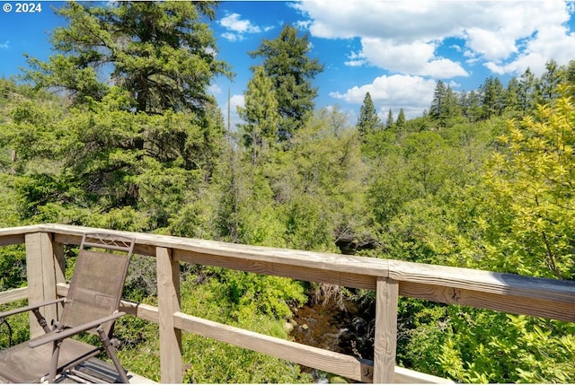 exterior space with a wooded view