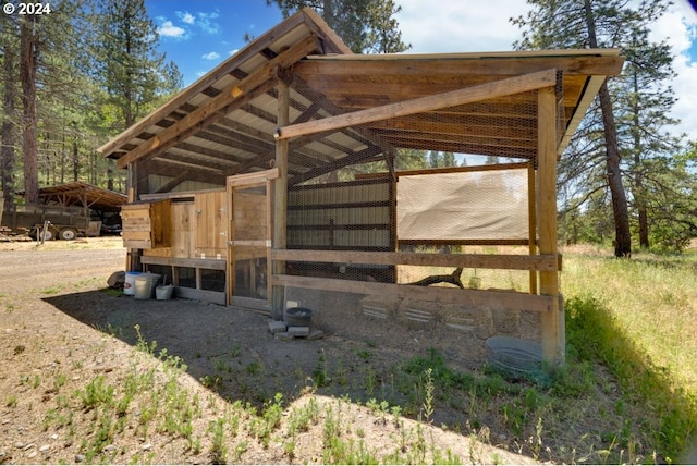 view of property's community with exterior structure and an outdoor structure