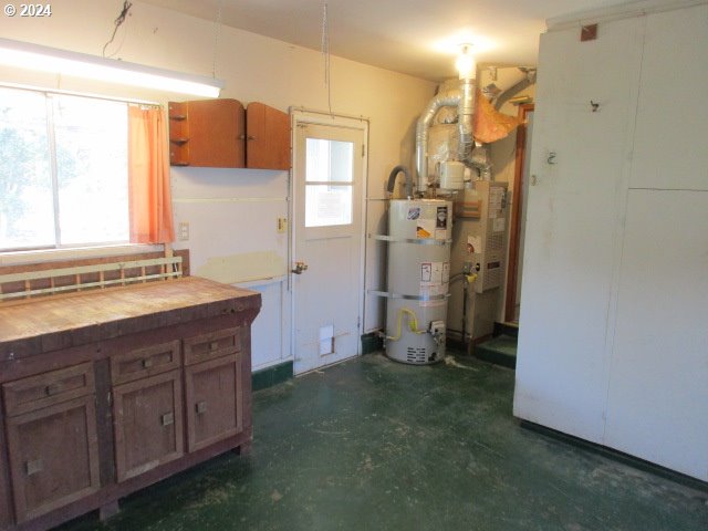 kitchen featuring strapped water heater