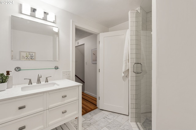 bathroom featuring vanity, a shower with shower door, and hardwood / wood-style flooring