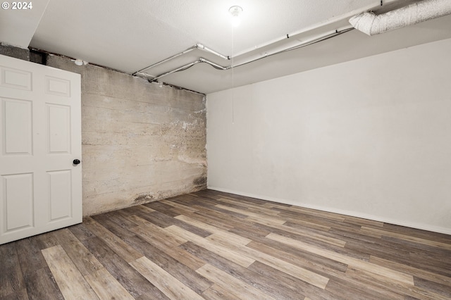 basement featuring hardwood / wood-style floors