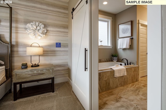 bathroom featuring tiled tub