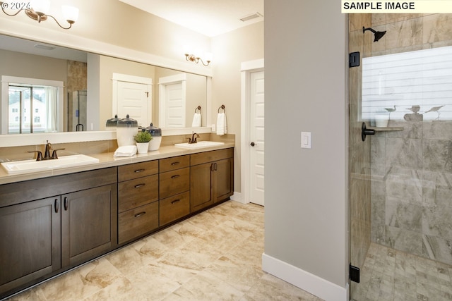 bathroom with vanity and an enclosed shower