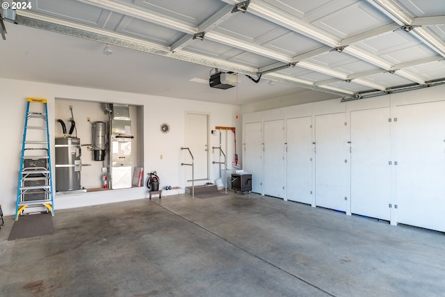 garage featuring gas water heater and a garage door opener