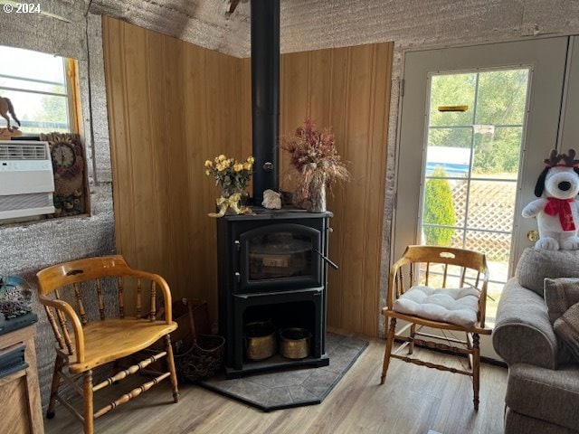 1020 John St, Haines, OR 97833 - sitting room featuring a wood stove and light wood-type flooring