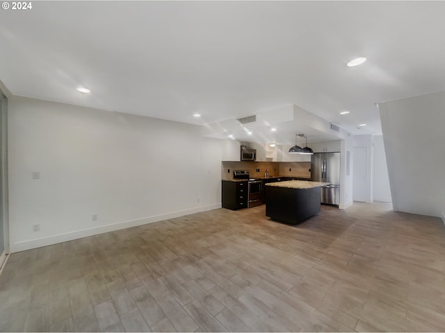 unfurnished living room with light hardwood / wood-style flooring