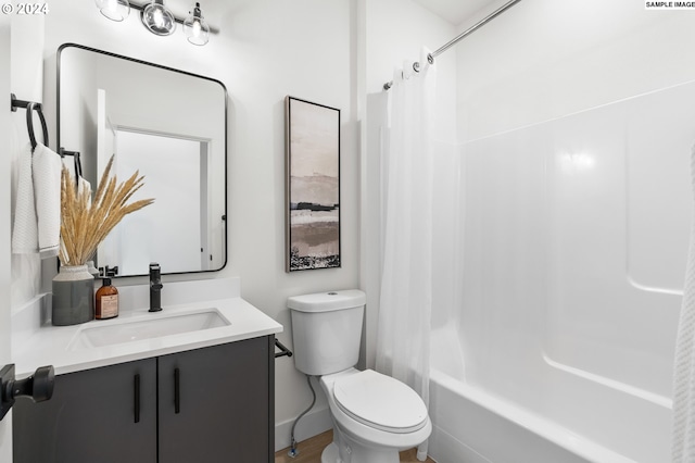 full bathroom featuring shower / tub combo with curtain, vanity, and toilet