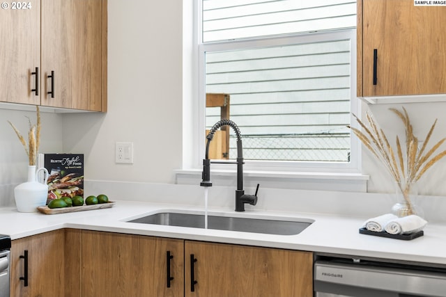 kitchen featuring dishwasher and sink