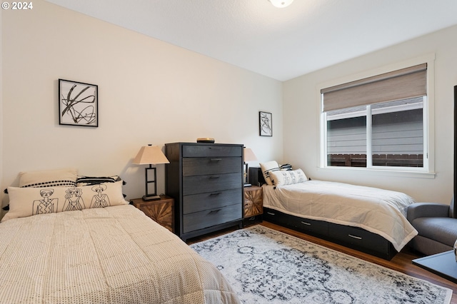 bedroom with wood-type flooring