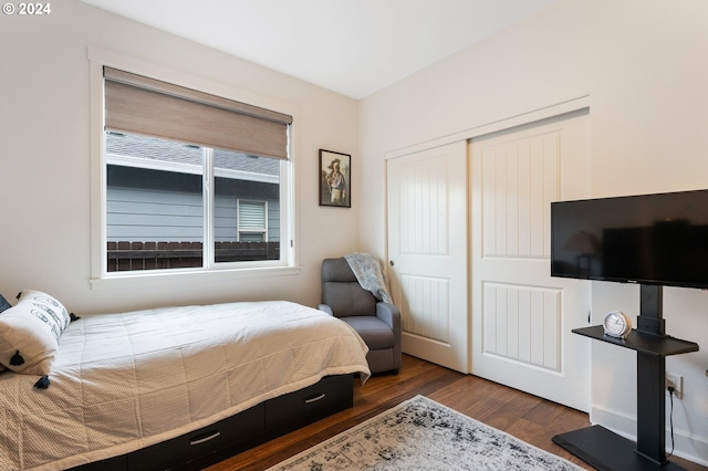 bedroom featuring a closet and dark hardwood / wood-style floors