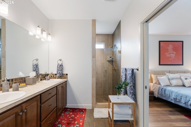 bathroom featuring vanity, wood-type flooring, and walk in shower