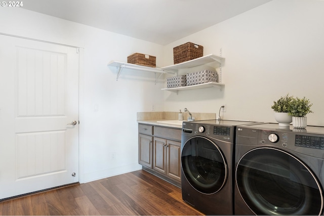 washroom with cabinets, washer and dryer, sink, and dark hardwood / wood-style floors