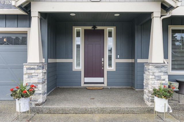 view of exterior entry featuring a garage