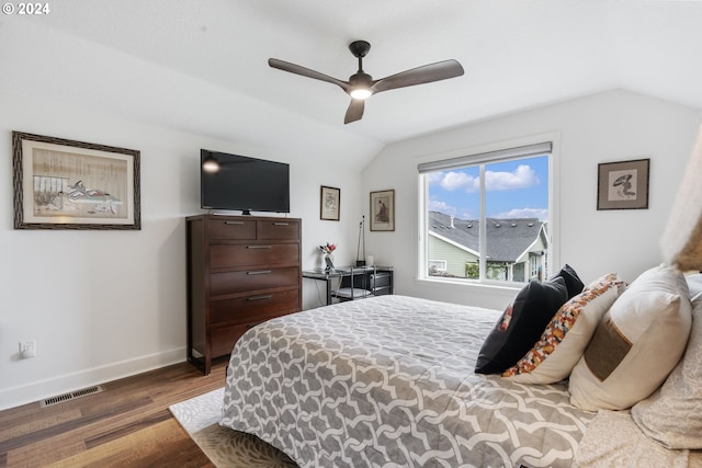 bedroom featuring lofted ceiling, dark wood-type flooring, and ceiling fan