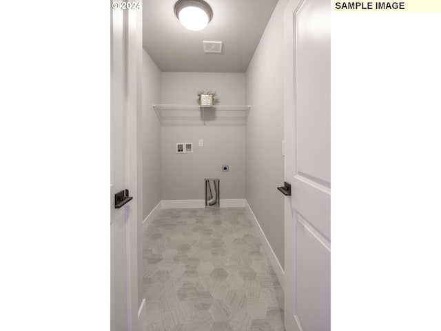 laundry room with hookup for a washing machine, hookup for an electric dryer, laundry area, visible vents, and baseboards