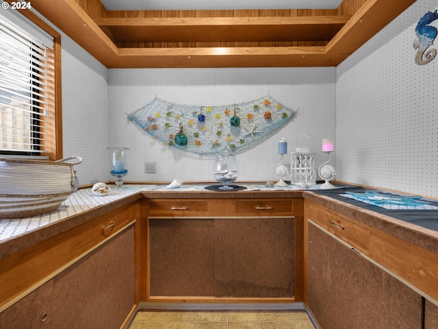 kitchen featuring tile counters and light tile patterned flooring