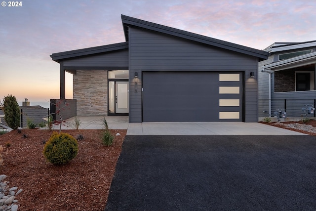 view of front of home with a garage