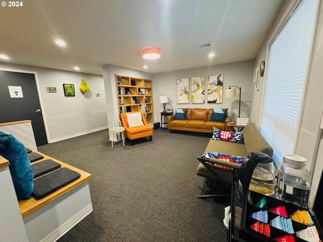 game room featuring dark colored carpet