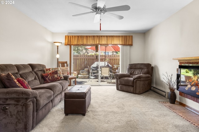 living room with carpet flooring, ceiling fan, and a baseboard radiator