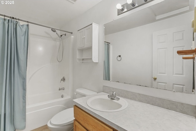 full bathroom with vanity, toilet, and shower / tub combo with curtain