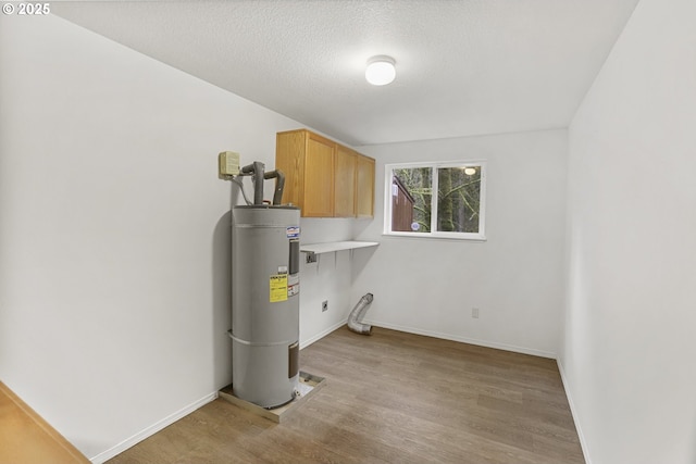 utility room featuring electric water heater