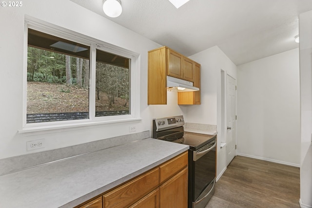 kitchen with dark wood-type flooring and stainless steel range with electric stovetop