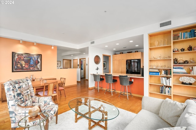 living room with light hardwood / wood-style flooring