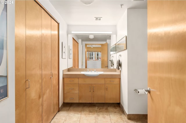 bathroom featuring vanity and tile patterned flooring