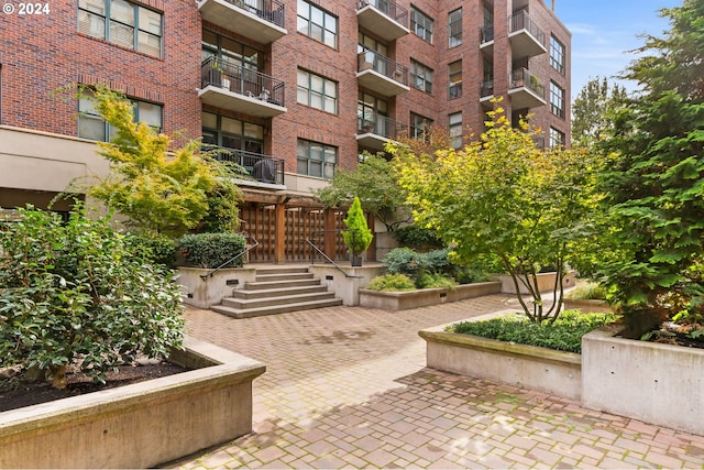 view of property's community featuring a patio