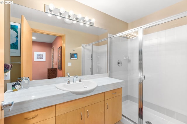 bathroom with vanity and walk in shower