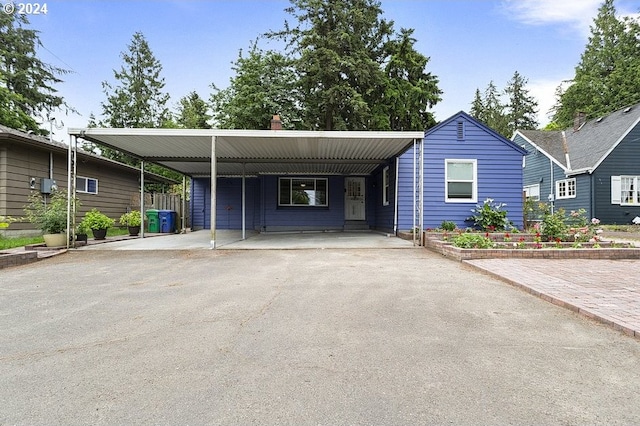 view of front of home featuring a carport