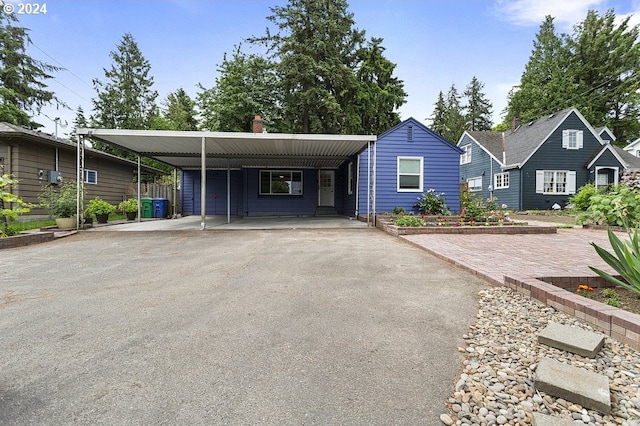 view of front of home featuring a carport