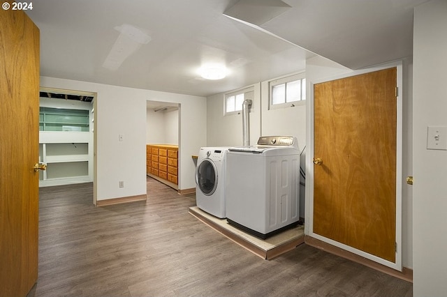 washroom with dark hardwood / wood-style flooring and separate washer and dryer