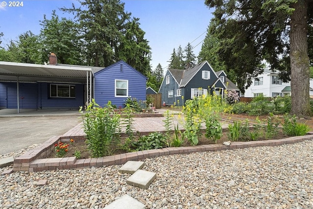 view of front of home featuring a carport