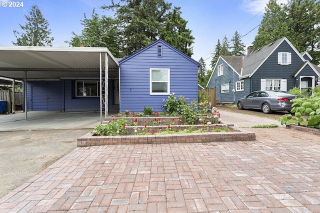 view of front of home featuring a carport