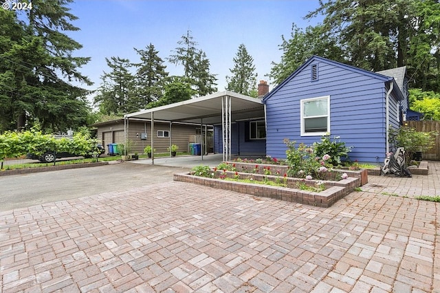 view of front of house featuring a carport