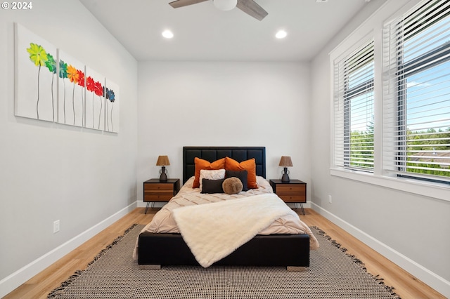 bedroom featuring hardwood / wood-style flooring and ceiling fan