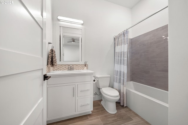 full bathroom featuring backsplash, shower / bath combo with shower curtain, vanity, and toilet