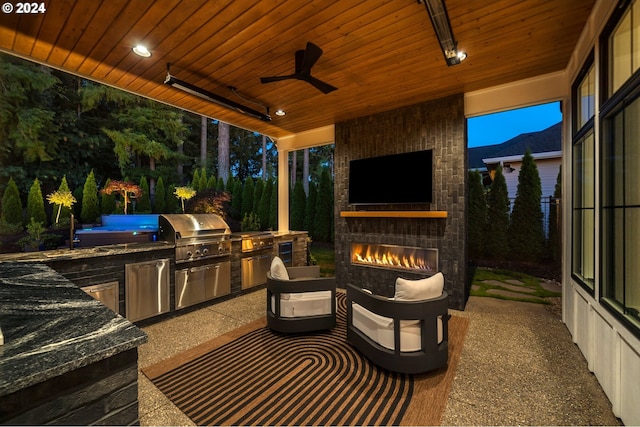 view of patio / terrace featuring grilling area, ceiling fan, a fireplace, and area for grilling