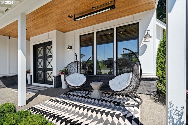 view of exterior entry with a porch