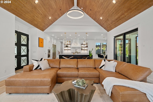 living room featuring wooden ceiling, high vaulted ceiling, and french doors