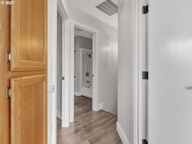 724 Kayla Way, Monmouth, OR 97361 - corridor with baseboards, visible vents, and light wood-style floors