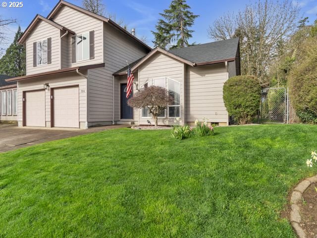 724 Kayla Way, Monmouth, OR 97361 - view of front facade with driveway, an attached garage, and a front lawn