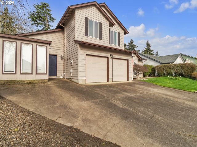 724 Kayla Way, Monmouth, OR 97361 - view of property exterior with concrete driveway and an attached garage