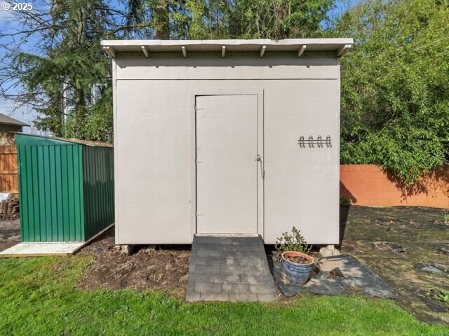 724 Kayla Way, Monmouth, OR 97361 - view of shed featuring a fenced backyard