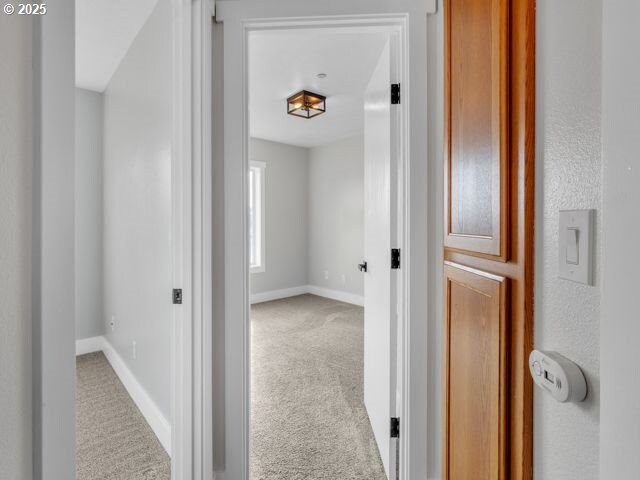 724 Kayla Way, Monmouth, OR 97361 - hall with baseboards and carpet flooring